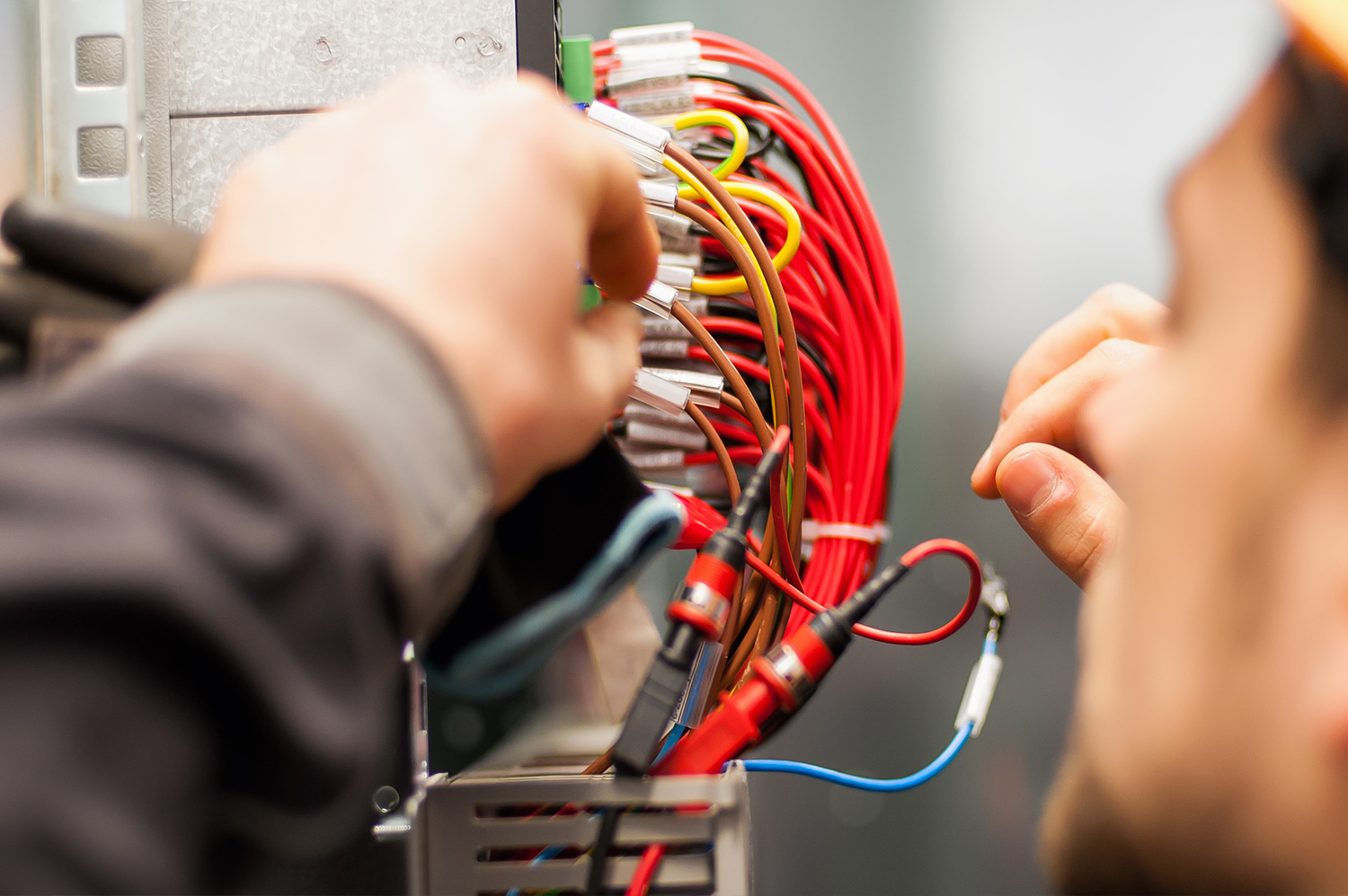 Electrical Engineer at work with wires through Electrical Engineering Jobs